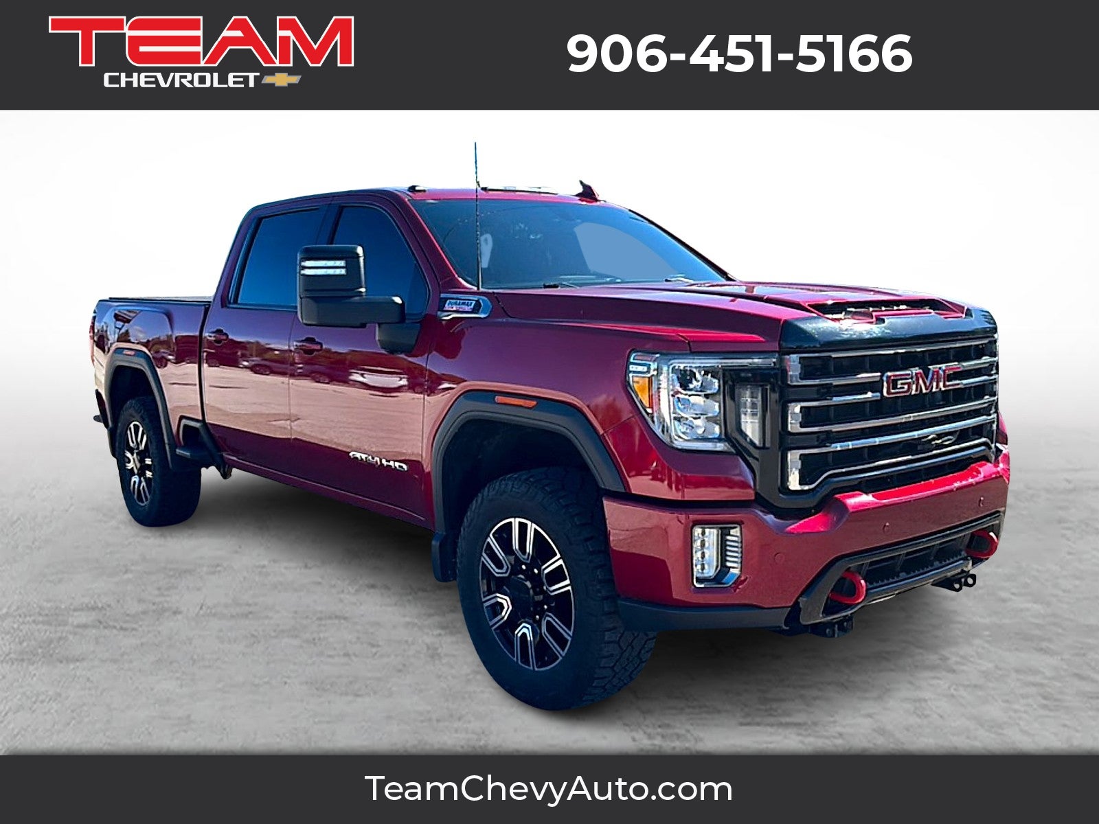 2020 GMC Sierra 2500 HD AT4 in Red Quartz Tintcoat — front three-quarter view