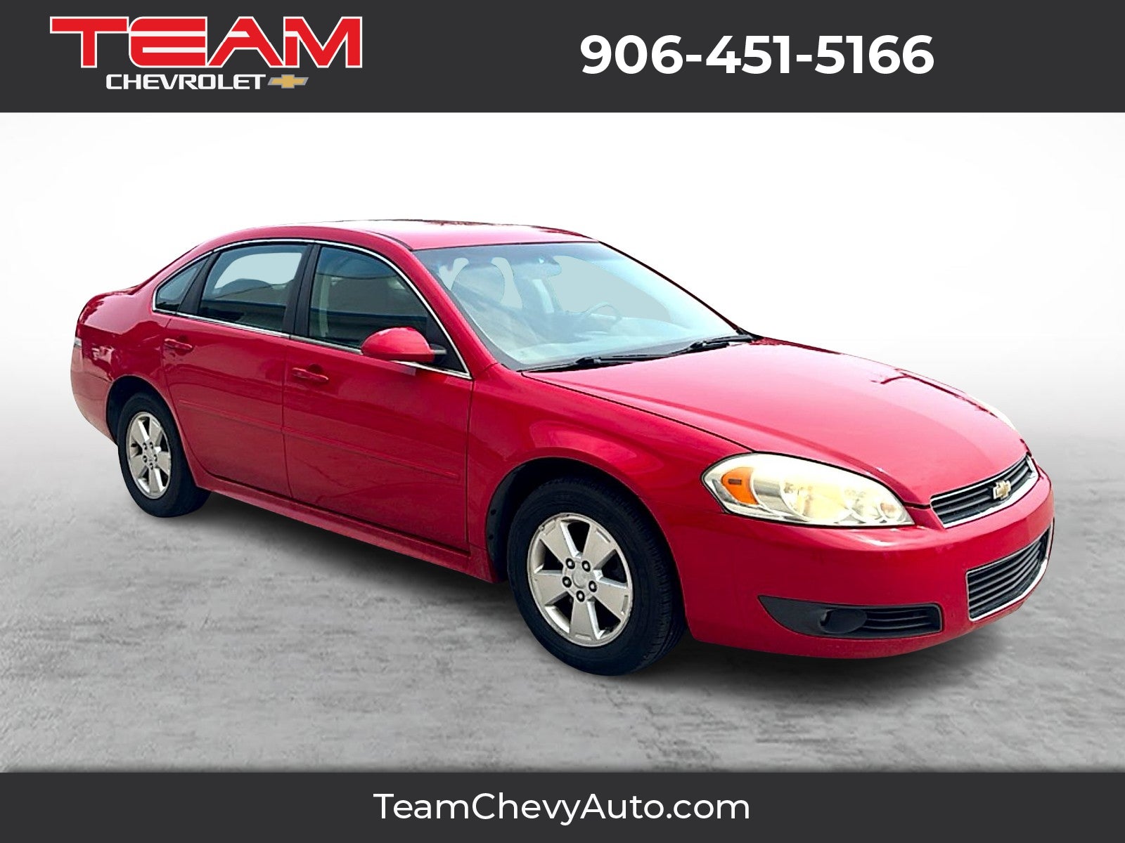 2010 Chevrolet Impala LT in Victory Red — front three-quarter view